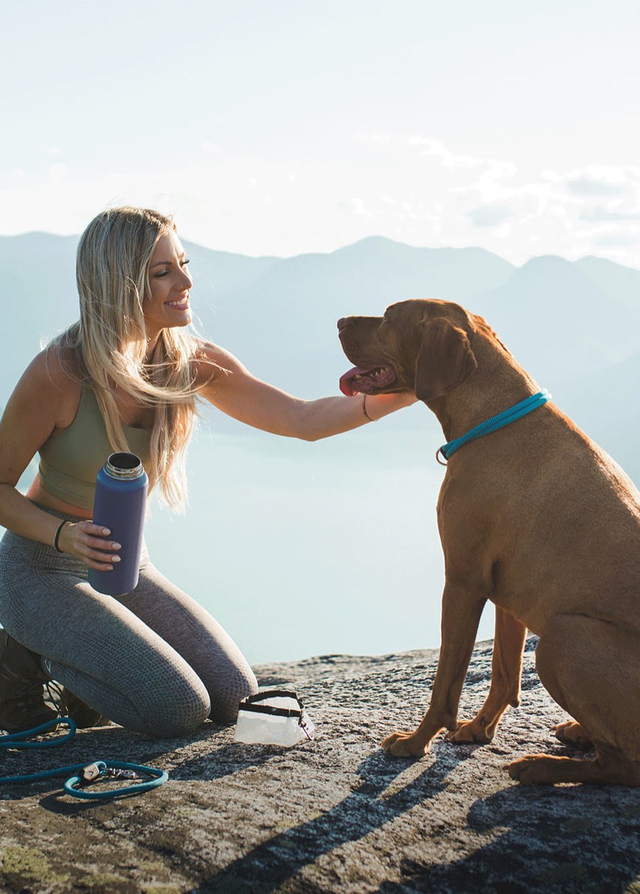 Atlas Pet Company dog and owner outdoors — mobile homepage hero