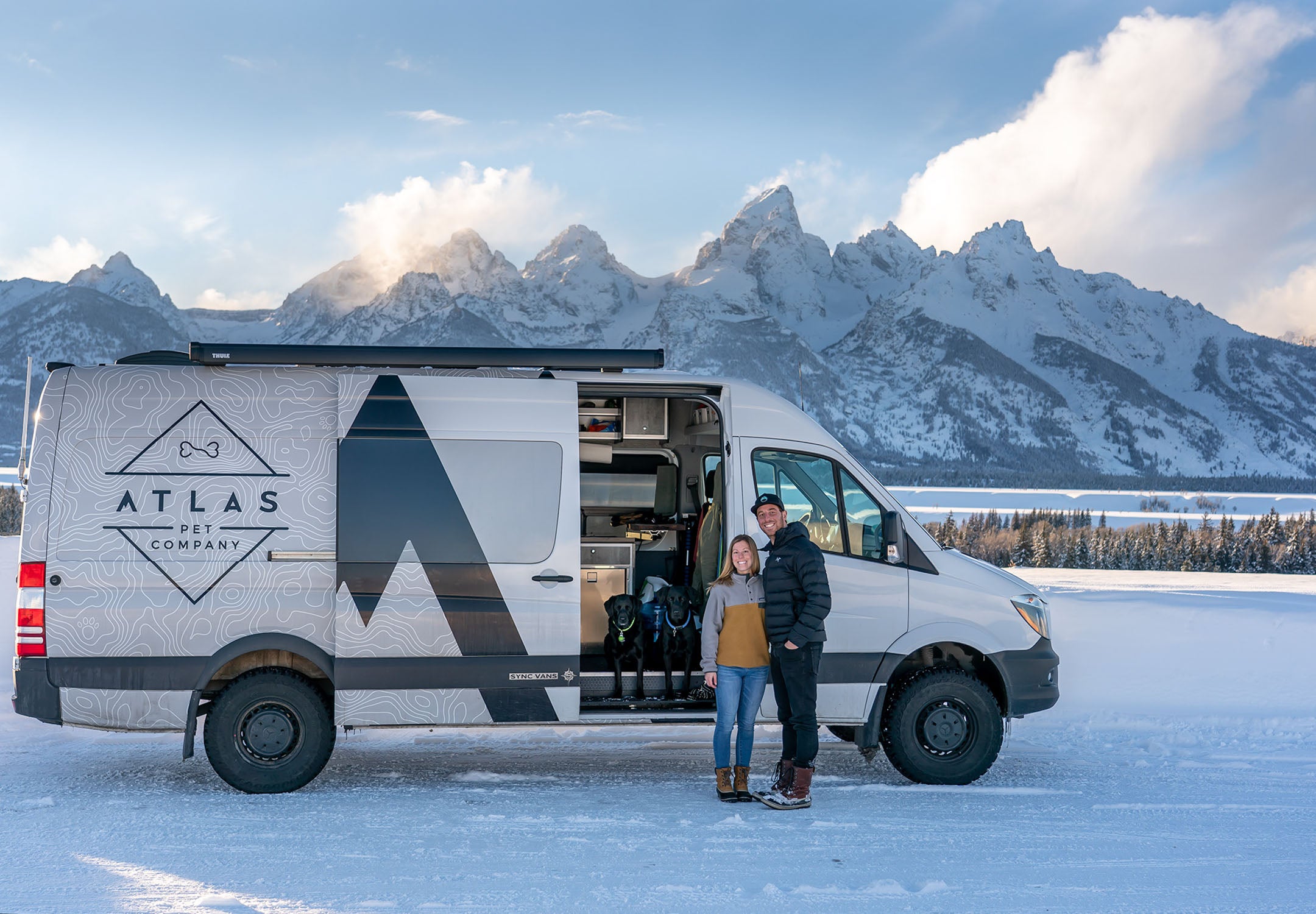 the atlas pet company van with the founder Sam Alter and his girlfriend in front of mountain back drop