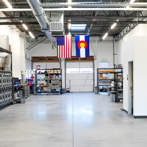 photo of the atlas pet company warehouse and topo print for the living wall and pegboard at the atlas pet company retail space in golden colorado
